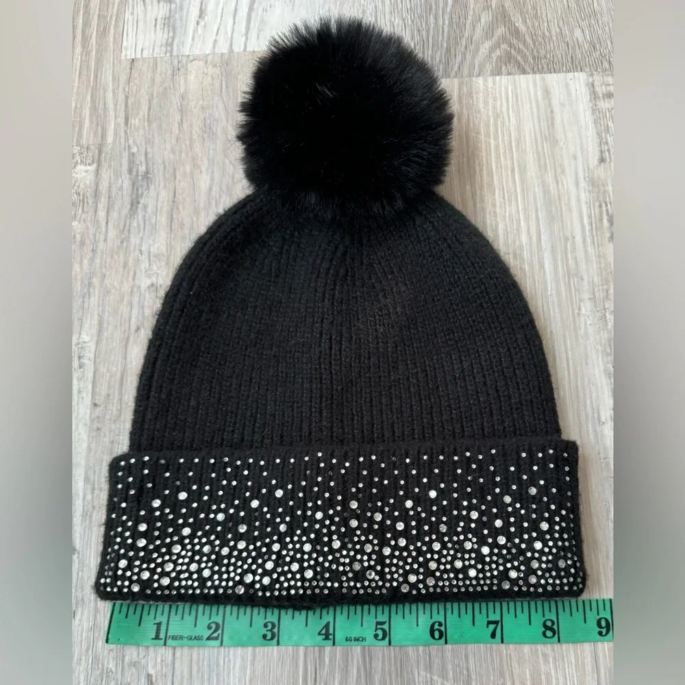 Madden NYC women’s beanie hat with decorative trim and pom-pom. Excellent condi